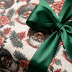 Retro Black Santa wrapping paper with a green satin bow, Christmas gift wrap by Wrapped Studios.