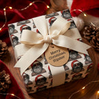Funny hipster Santa Christmas wrapping paper by Wrapped Studios on a gift box with a cream bow.