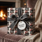 Cool Santa Christmas wrapping paper with a gray bow by Wrapped Studios, in a cozy fireplace setting.