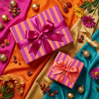 Vibrant pink and orange striped wrapping paper with satin bows on a luxury festive flat lay by Wrapped Studios.