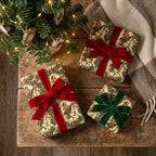 Vintage equestrian Christmas wrapping paper on gifts with velvet bows by Wrapped Studios.