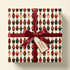 Cozy winter bear Christmas wrapping paper with a burgundy satin bow by Wrapped Studios.