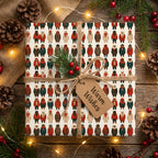 Cute winter bear Christmas gift wrap by Wrapped Studios, tied with twine on a rustic wooden table.