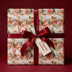 Vintage Christmas wrapping paper with holiday baking print and burgundy bow by Wrapped Studios.