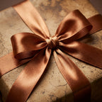 Elegant gift wrapped in vintage-style brown paper and tied with a bronze satin ribbon.
