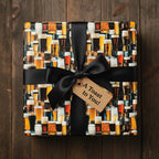 Square gift wrapped in beer-themed paper with black ribbon and "A Toast to You!" tag.