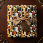 Beer lover gift wrap: a present wrapped in beer glass patterned paper, with a burlap bow and "For the Connoisseur" tag.