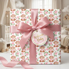 Cute monkey baby shower wrapping paper with pink satin ribbon and Welcome Baby tag by Wrapped Studios.