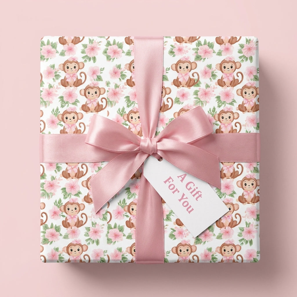 Pink monkey baby shower wrapping paper with floral pattern and satin bow by Wrapped Studios.