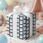 Cute polar bear baby shower wrapping paper on a gift box with a white ribbon by Wrapped Studios.