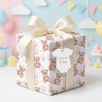 Pink teddy bear baby shower wrapping paper by Wrapped Studios with a cream bow and Welcome Baby tag.