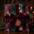 Luxury Christmas wrapping paper with burgundy velvet ribbon and a Merry & Bright tag by Wrapped Studios.