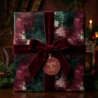 Luxury Christmas wrapping paper with burgundy velvet ribbon and a Merry & Bright tag by Wrapped Studios.