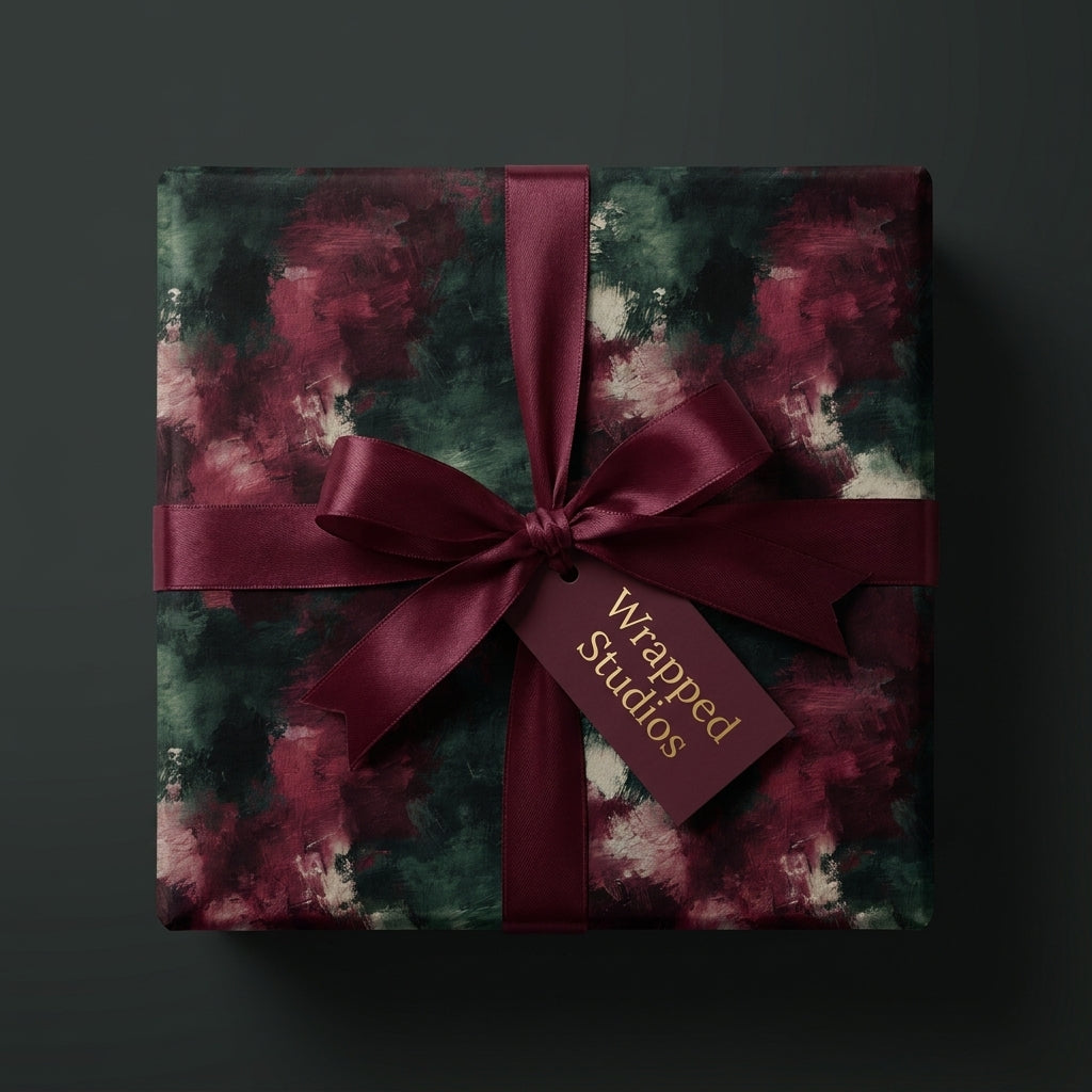 Luxury burgundy and green abstract Christmas gift wrap with a satin ribbon bow by Wrapped Studios.