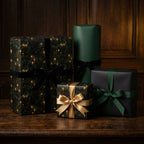 Elegant gifts wrapped in unique black and gold paper, tied with velvet ribbons, from Wrapped Studios.
