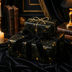 Elegant black gift wrap with bookshelf print, gold string and black velvet bow.