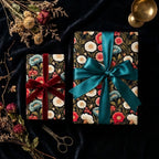 Moody vintage floral wrapping paper with luxury teal and red ribbons by Wrapped Studios.