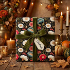 Vintage floral wrapping paper with a green velvet bow in a cozy autumn setting by Wrapped Studios.