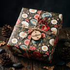 Vintage dark floral wrapping paper with rustic twine on a gift box by Wrapped Studios.