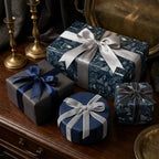 Elegant navy botanical wrapping paper and luxury gift wrap with satin ribbons by Wrapped Studios.