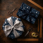 Luxury dark floral wrapping paper by Wrapped Studios on navy gifts with silver and blue velvet ribbons.