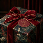 Luxury vintage floral wrapping paper with a red velvet bow by Wrapped Studios.
