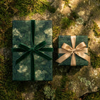 Luxury forest wrapping paper with green velvet and gold ribbons on mossy stone by Wrapped Studios.