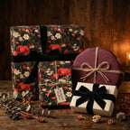 Luxury floral wrapping paper with red poppies and black velvet bows by Wrapped Studios.