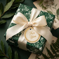 Luxury green floral wrapping paper with cream satin ribbon and a For You gift tag by Wrapped Studios.