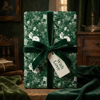 Vintage green floral wrapping paper with a velvet bow and "With Love" gift tag by Wrapped Studios.