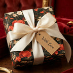Luxury vintage floral wrapping paper with red poppies and cream satin ribbon by Wrapped Studios.