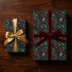 Luxury botanical floral wrapping paper with gold and burgundy velvet ribbons by Wrapped Studios.