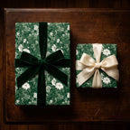 Luxury green floral wrapping paper with elegant velvet and satin bows by Wrapped Studios.