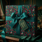 Luxury green floral Christmas wrapping paper with teal bow and gift tag by Wrapped Studios.
