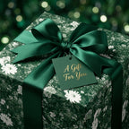 Luxury dark green Christmas floral wrapping paper with satin bow and gift tag, by Wrapped Studios.