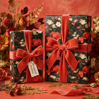 Luxury dark floral wrapping paper featuring red poppy patterns and red velvet bows by Wrapped Studios.