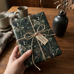 Vintage floral wrapping paper by Wrapped Studios on a rustic gift tied with twine.