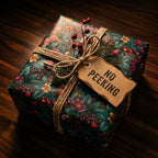 Vintage floral Christmas wrapping paper by Wrapped Studios on a gift with rustic twine and a No Peeking tag.