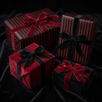 Elegant gifts wrapped in striped black/red wrapping paper with velvet bows; luxury gift wrap for any occasion.