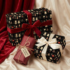 Elegant Christmas gift wrap with a cute cat and tree pattern, tied with red velvet and ivory satin ribbons.