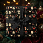 Festive cat-themed Christmas wrapping paper with a black ribbon on a gift box.