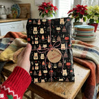 Festive cat-themed gift wrap with a "no peeking" tag, tied with red and white baker's twine on a rustic wooden table.
