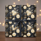 Luxury black and gold Christmas gift wrap with elegant floral design and black ribbon by Wrapped Studios.