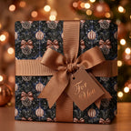 Luxury Christmas wrapping paper in navy and bronze pinecone print with a bow by Wrapped Studios.