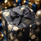 Luxury Christmas wrapping paper with cream roses, gold ornaments, and a grey bow. Wrapped Studios.