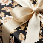 Luxury vintage floral wrapping paper with a cream satin bow by Wrapped Studios.