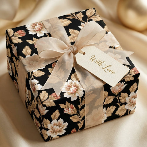 Luxury black floral wrapping paper with a champagne ribbon and "With Love" tag by Wrapped Studios.