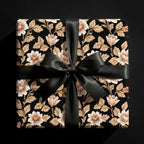Luxury vintage floral wrapping paper with a black satin bow on a gift box by Wrapped Studios.