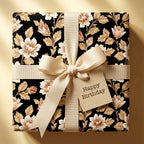 Elegant black and cream floral wrapping paper with a Happy Birthday tag, by Wrapped Studios.