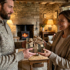 Couple exchanging a gift wrapped in rustic stone pattern wrapping paper with a burlap ribbon by Wrapped Studios.